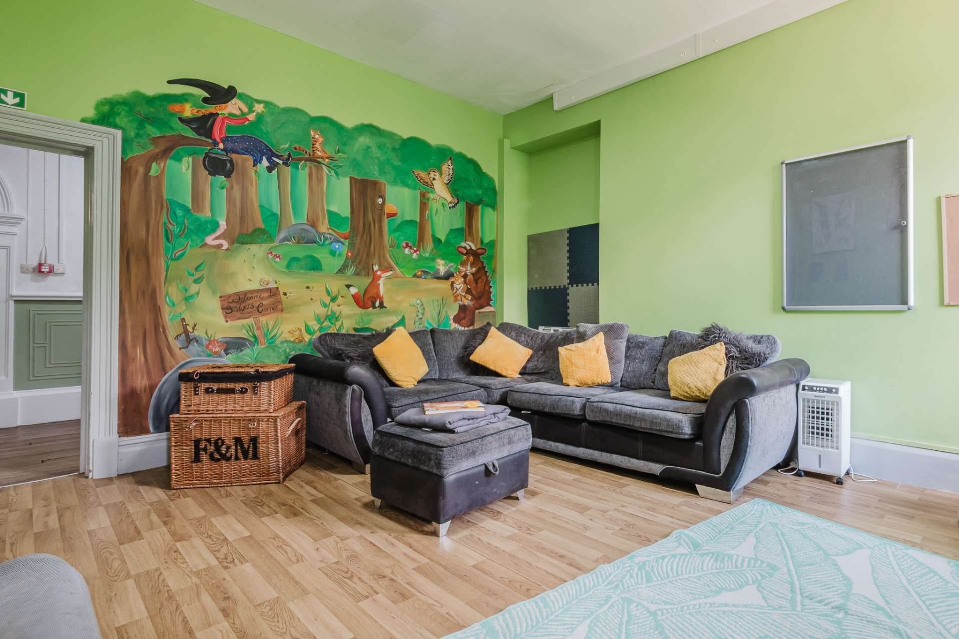 Lounge with woodland story mural