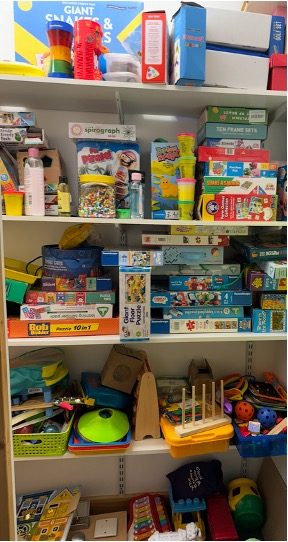 Shelves of learning resources, games and sensory toys