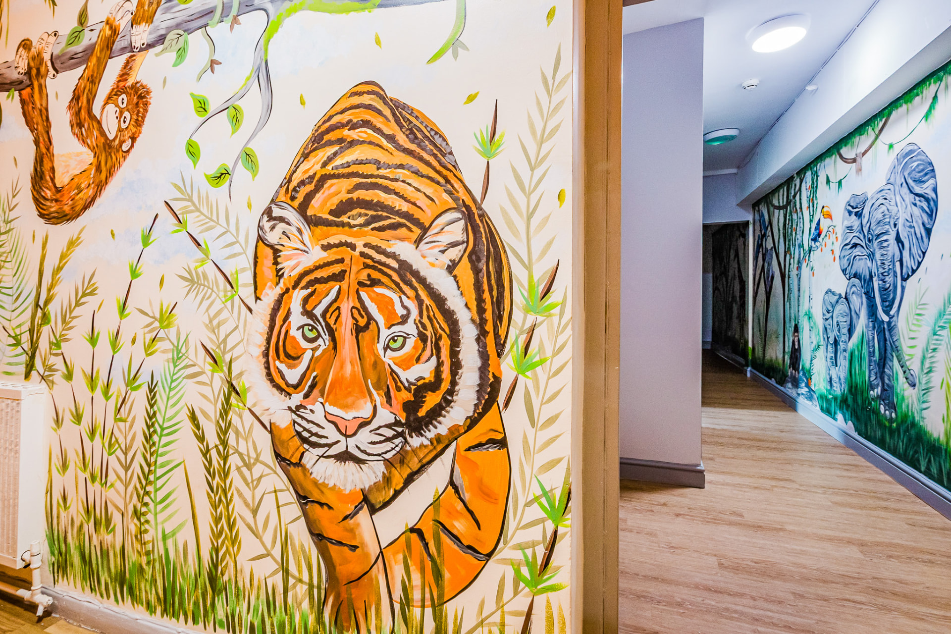 Hand-painted tiger mural in the corridor