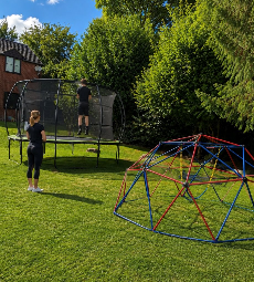Garden with trampoline and climbing frame at Harlescott House