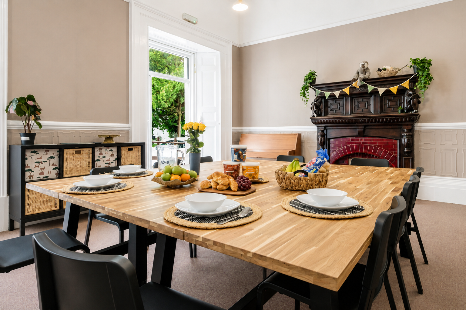 Dining table laid out with fresh fruit and breakfast