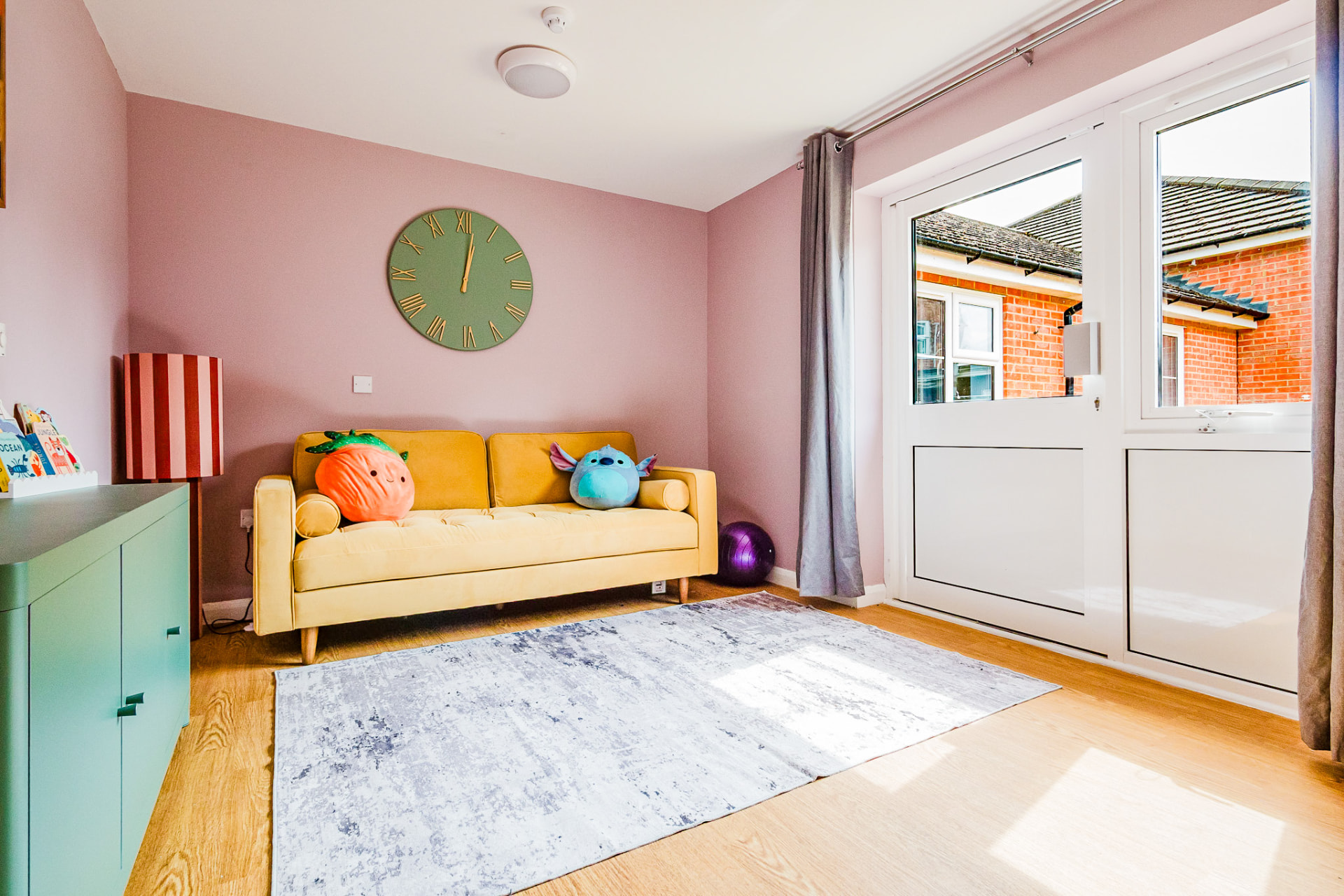 Calm lounge with yellow sofa and soft furnishings