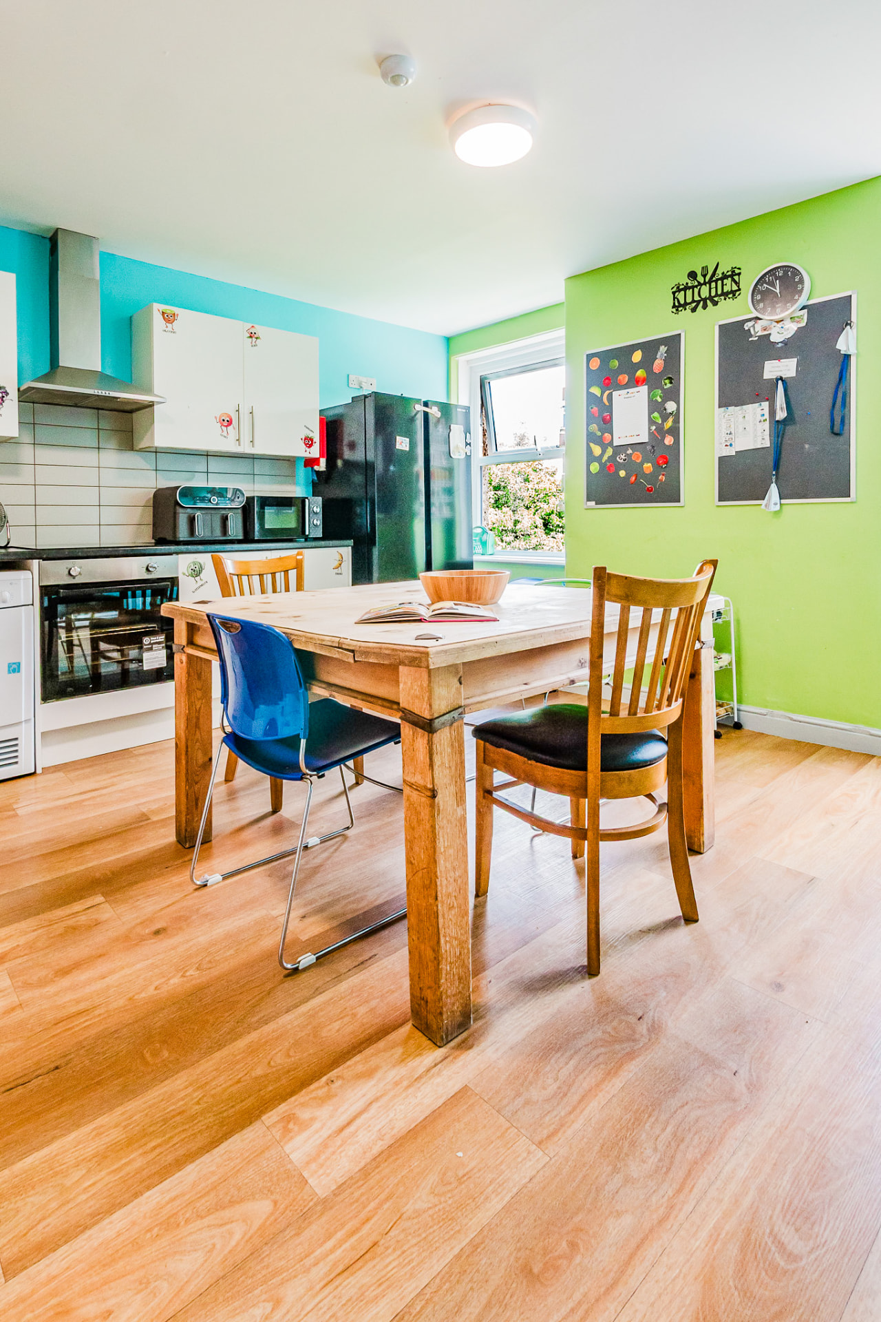 Kitchen dining area with menu boards and natural light