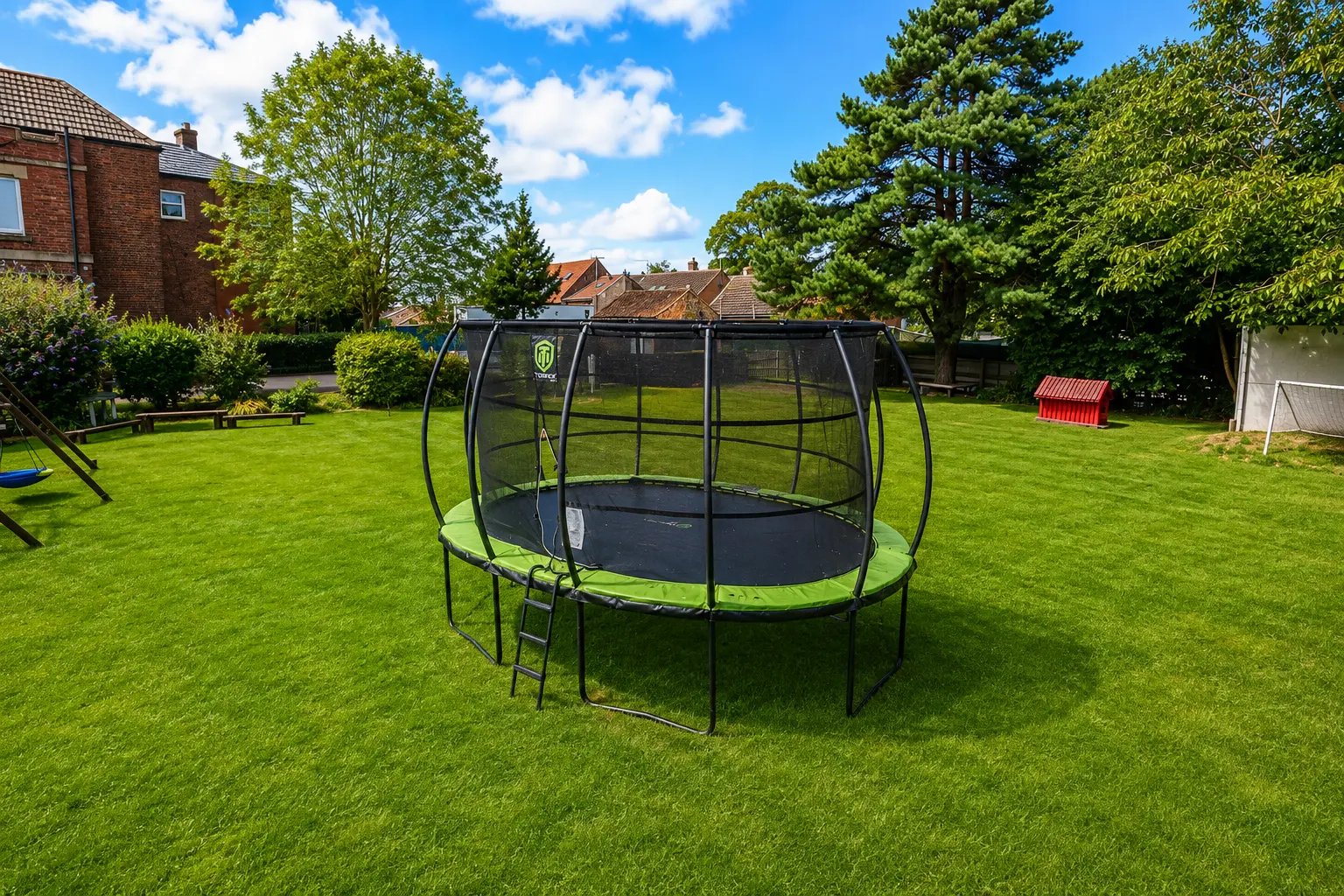 Large trampoline on the lawn in the school garden
