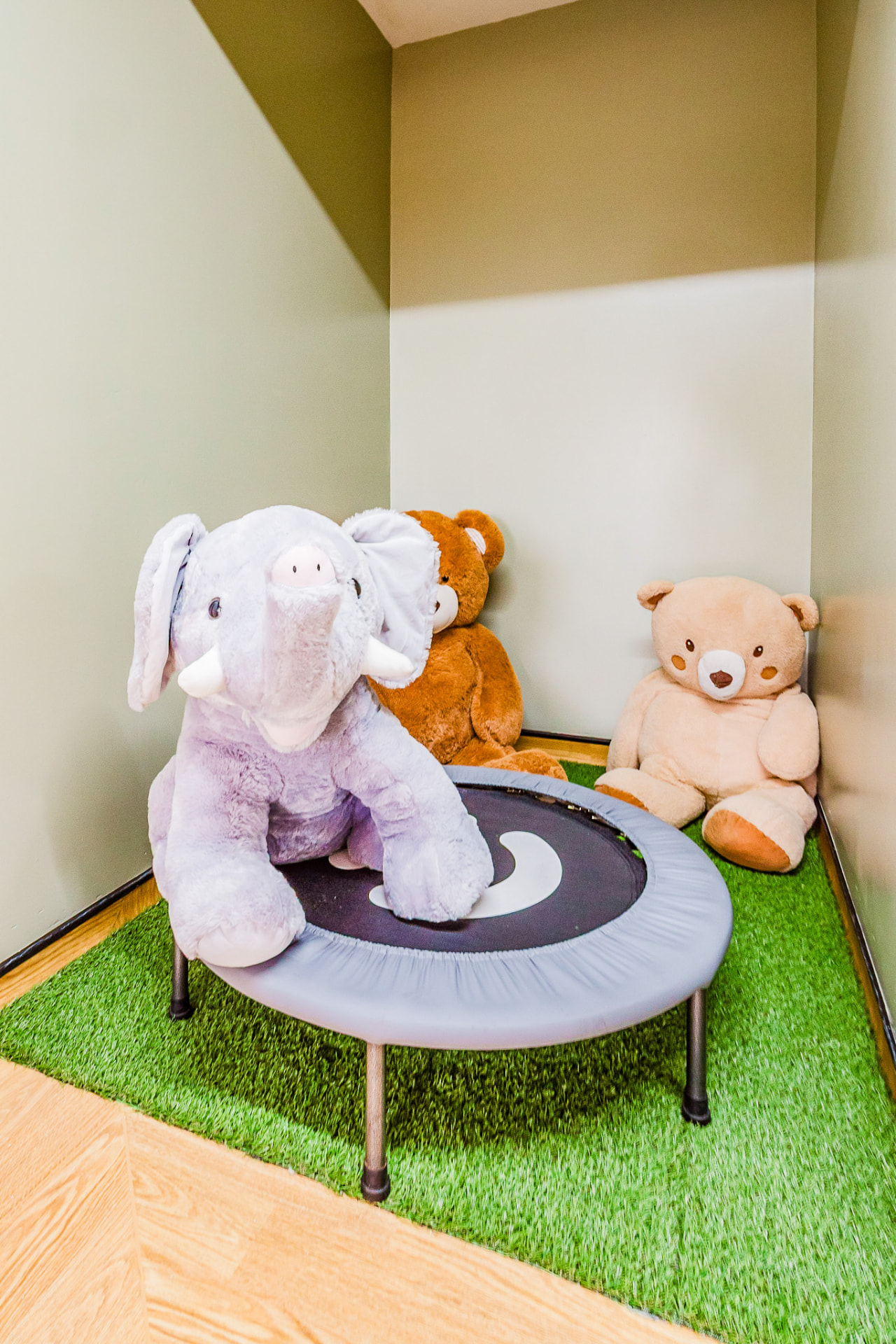 Small trampoline and soft toys in a movement corner