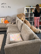 Cosy lounge with sofa and soft toys at Harlescott House
