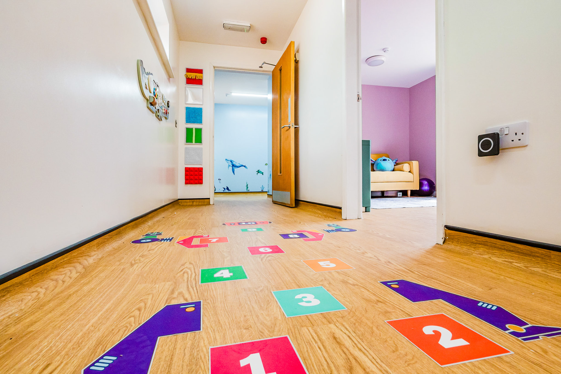 Hallway with hopscotch floor markings and quiet room