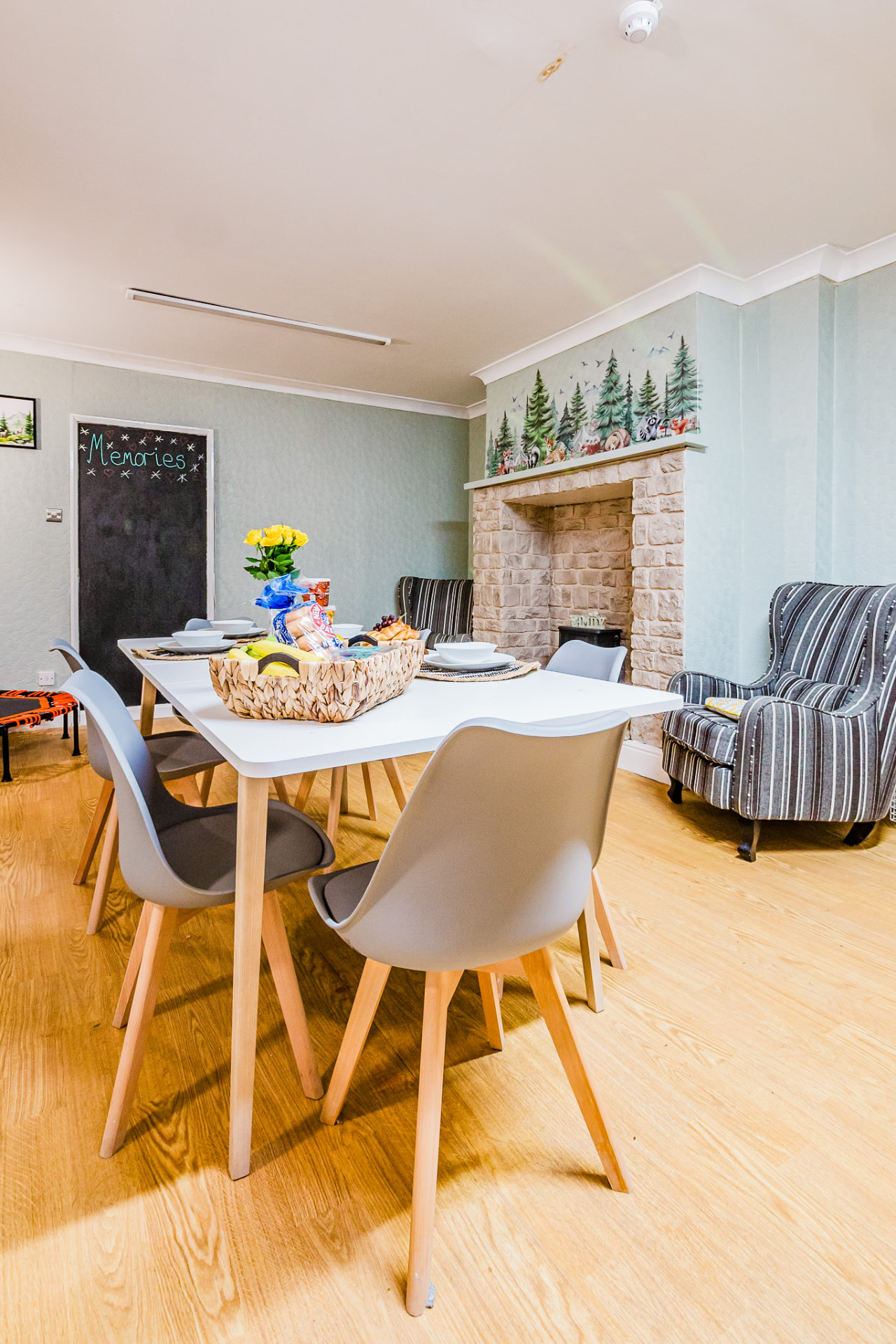 Dining table set for breakfast beside the lounge